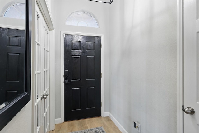 15429 Calico Ct, Frisco, TX 75035 - entryway featuring light wood-style floors and baseboards