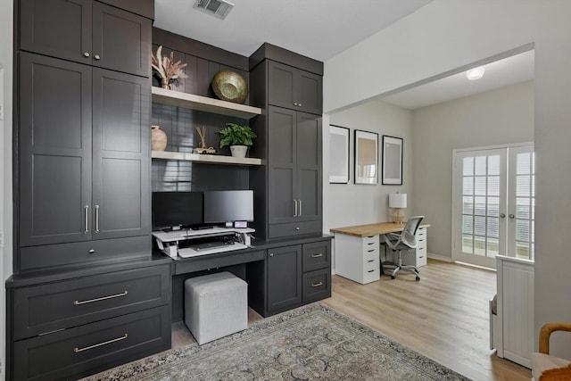 15429 Calico Ct, Frisco, TX 75035 - office area featuring light wood-style flooring, built in desk, and baseboards