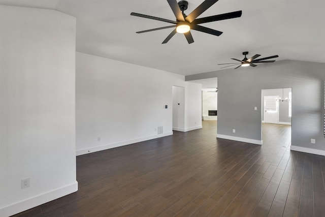 3013 Flowering Springs Dr, Forney, TX 75126 - unfurnished living room with a ceiling fan, dark wood-type flooring, baseboards, and vaulted ceiling