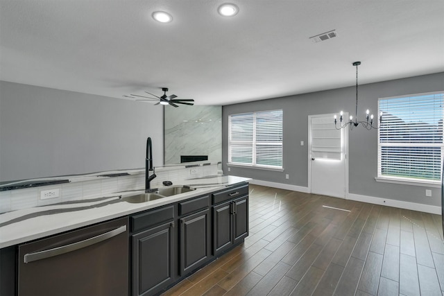 3013 Flowering Springs Dr, Forney, TX 75126 - kitchen featuring stainless steel dishwasher, a sink, healthy amount of natural light, a chandelier, and recessed lighting