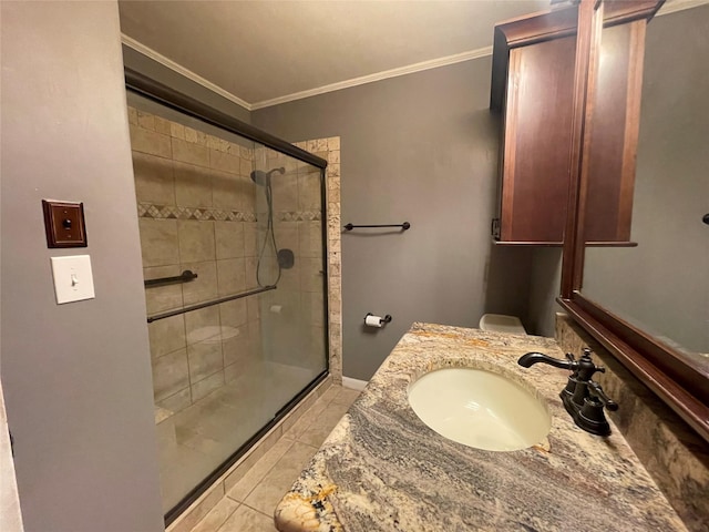 310 Lancashire Dr, Bossier City, LA 71111 - bathroom featuring crown molding, a stall shower, tile patterned flooring, vanity, and toilet