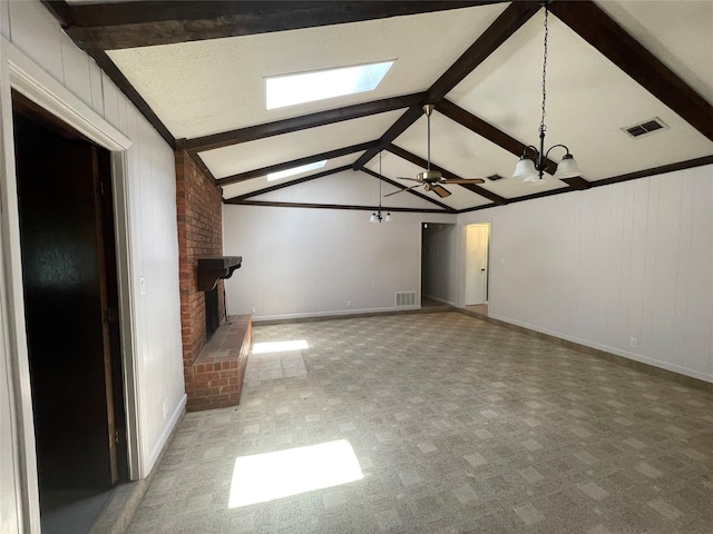 310 Lancashire Dr, Bossier City, LA 71111 - unfurnished living room featuring a fireplace, baseboards, a chandelier, a skylight, and a ceiling fan