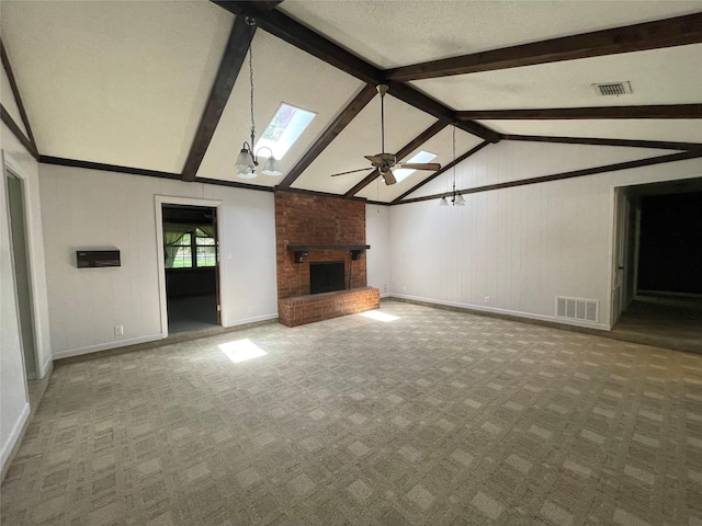 310 Lancashire Dr, Bossier City, LA 71111 - unfurnished living room with a brick fireplace, carpet, baseboards, ceiling fan, and a skylight
