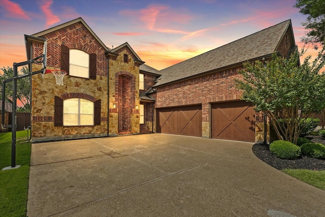 14759 Huffman Ln, Frisco, TX 75035 - view of front of property with stone siding, roof with shingles, concrete driveway, brick siding, and a garage