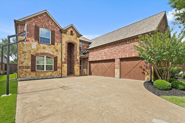 14759 Huffman Ln, Frisco, TX 75035 - view of front of house featuring stone siding, a shingled roof, driveway, and a garage