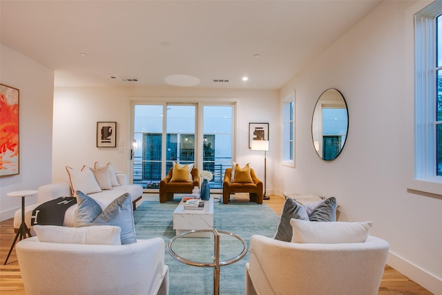 7207 Gaston Ave Unit 1006, Dallas, TX 75214 - living area featuring light wood-style flooring, baseboards, and recessed lighting
