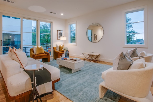 7207 Gaston Ave Unit 1006, Dallas, TX 75214 - living room featuring wood finished floors, baseboards, and recessed lighting