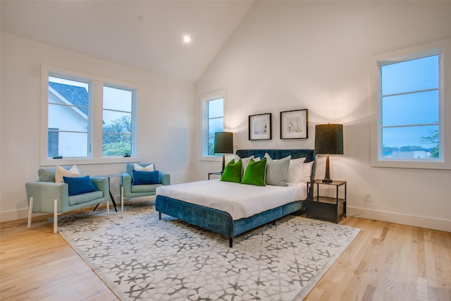7207 Gaston Ave Unit 1006, Dallas, TX 75214 - bedroom featuring baseboards, wood finished floors, high vaulted ceiling, and recessed lighting