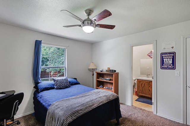 5730 Rendon Estates Rd, Mansfield, TX 76063 - bedroom featuring light colored carpet, connected bathroom, ceiling fan, a sink, and a textured ceiling