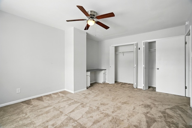 2729 Caton Pl, Abilene, TX 79605 - unfurnished bedroom with multiple closets, carpet floors, baseboards, a ceiling fan, and an office area