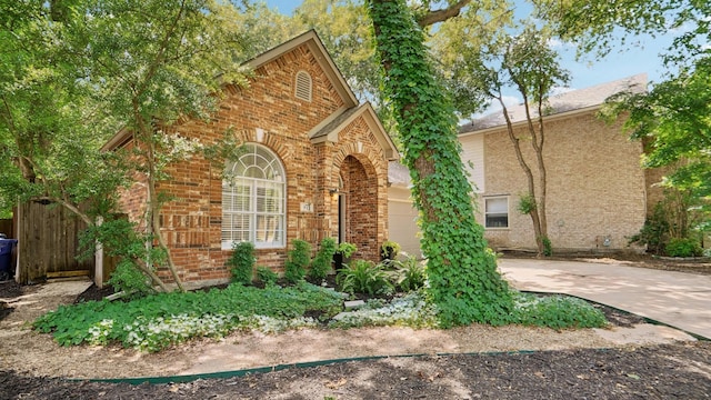 713 N Jordan Rd, Mckinney, TX 75071 - view of side of property featuring brick siding and driveway