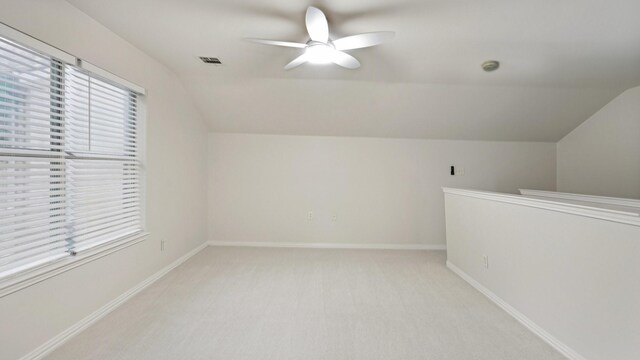 713 N Jordan Rd, Mckinney, TX 75071 - additional living space with vaulted ceiling, a ceiling fan, light colored carpet, and baseboards