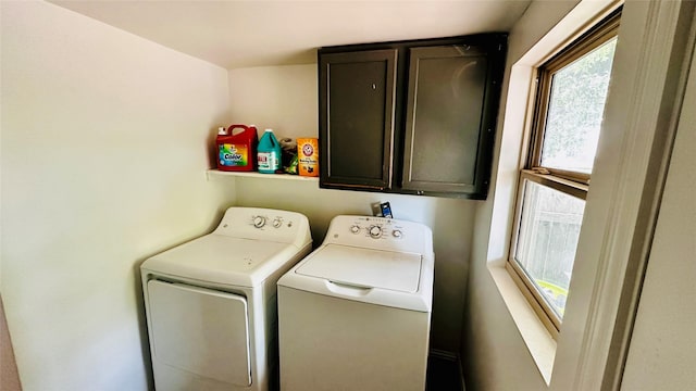 3030 Warren Ave, Dallas, TX 75215 - laundry area with washing machine and dryer and cabinet space