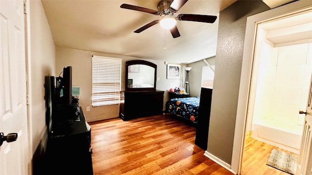 3030 Warren Ave, Dallas, TX 75215 - bedroom featuring wood finished floors, a ceiling fan, and lofted ceiling