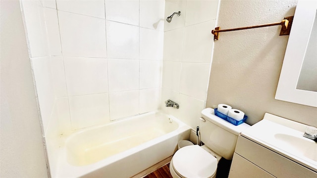 3030 Warren Ave, Dallas, TX 75215 - full bathroom featuring toilet, a textured wall, tub / shower combination, and vanity