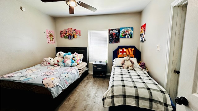 3030 Warren Ave, Dallas, TX 75215 - bedroom featuring wood finished floors and ceiling fan