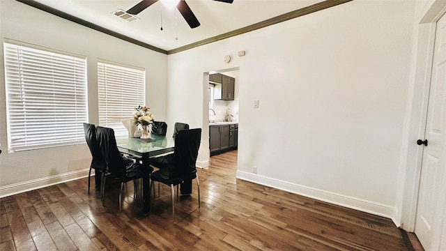 3030 Warren Ave, Dallas, TX 75215 - dining room with ceiling fan, hardwood / wood-style floors, ornamental molding, and baseboards