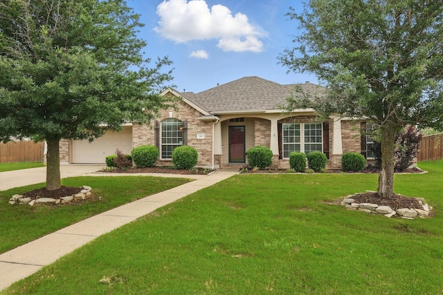 209 Lariat Dr, Fate, TX 75087 - view of front of home with concrete driveway, brick siding, a shingled roof, and a garage