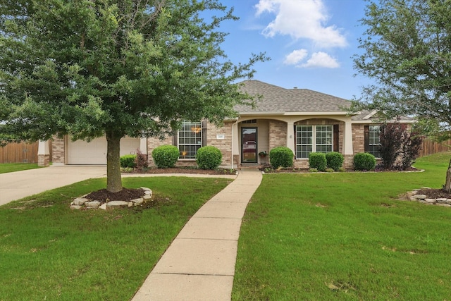 209 Lariat Dr, Fate, TX 75087 - view of front of property with brick siding, concrete driveway, roof with shingles, and an attached garage