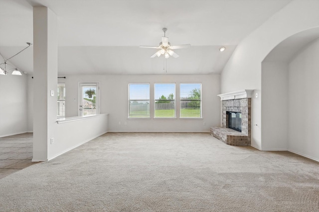 209 Lariat Dr, Fate, TX 75087 - unfurnished living room with carpet flooring, ceiling fan, lofted ceiling, a fireplace, and baseboards