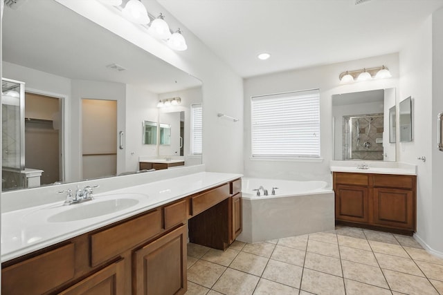 209 Lariat Dr, Fate, TX 75087 - bathroom with a stall shower, a garden tub, two vanities, and tile patterned flooring