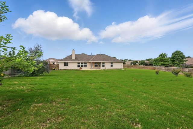 209 Lariat Dr, Fate, TX 75087 - back of property with a chimney