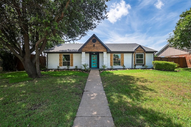 1112 Seabrook Dr, Plano, TX 75023 - view of front of home featuring brick siding and a shingled roof