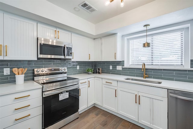 1112 Seabrook Dr, Plano, TX 75023 - kitchen featuring stainless steel appliances, a sink, and light countertops