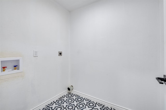 1112 Seabrook Dr, Plano, TX 75023 - laundry area featuring electric dryer hookup, washer hookup, baseboards, and tile patterned floors