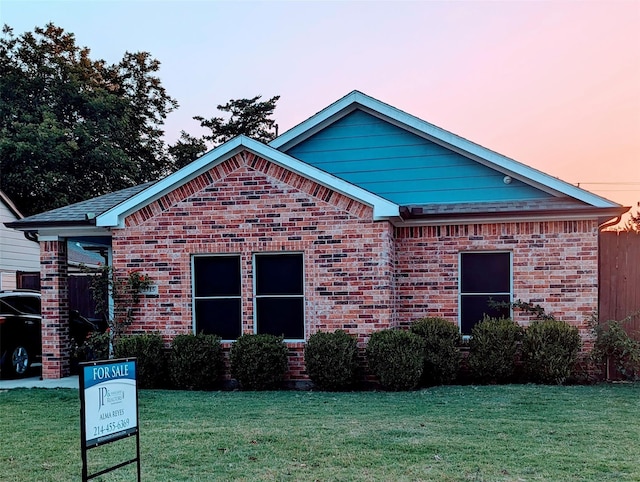 2715 Britton Ave, Dallas, TX 75216 - view of property exterior featuring a yard and brick siding