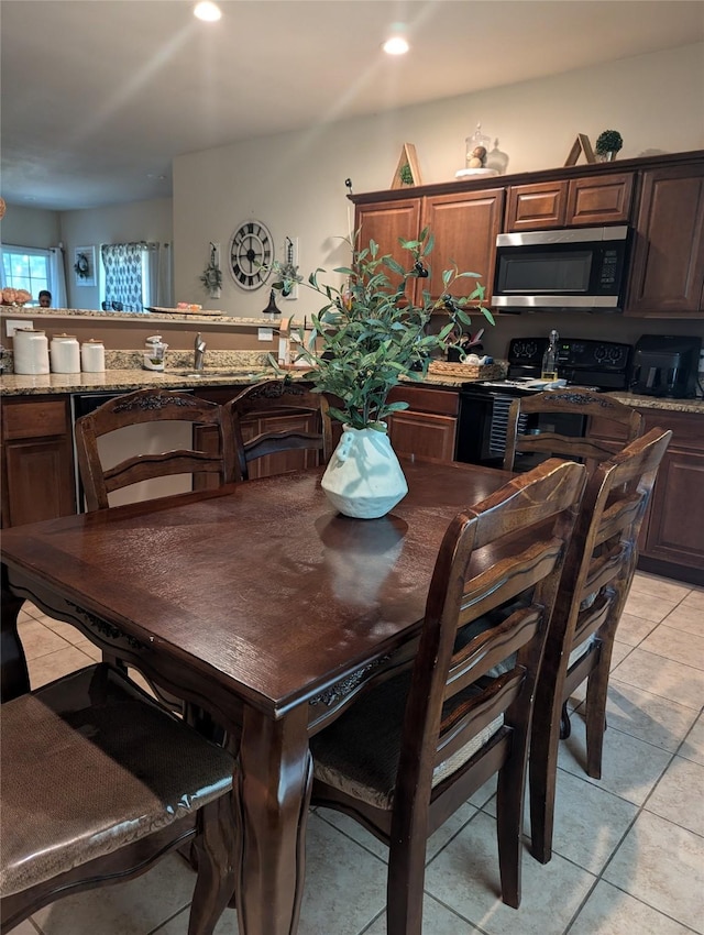 2715 Britton Ave, Dallas, TX 75216 - dining space featuring light tile patterned floors and recessed lighting