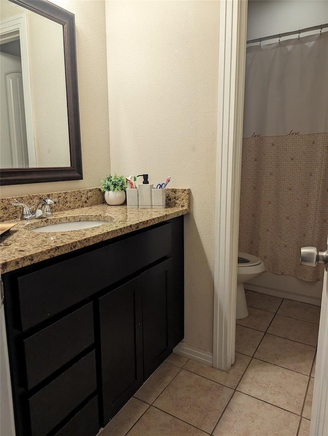 2715 Britton Ave, Dallas, TX 75216 - bathroom featuring tile patterned floors, vanity, and toilet