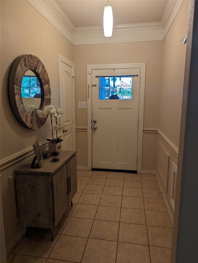 2715 Britton Ave, Dallas, TX 75216 - entrance foyer featuring crown molding, light tile patterned floors, and a wainscoted wall