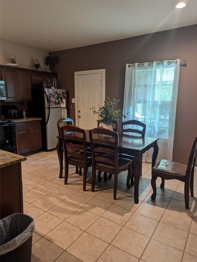 2715 Britton Ave, Dallas, TX 75216 - dining area featuring light tile patterned floors and recessed lighting