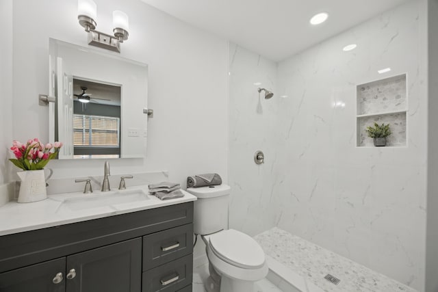 1629 Mesquite Trl, Plano, TX 75023 - bathroom featuring vanity, toilet, a marble finish shower, and a ceiling fan