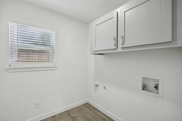 1629 Mesquite Trl, Plano, TX 75023 - washroom with cabinet space, wood finished floors, baseboards, hookup for a washing machine, and electric dryer hookup