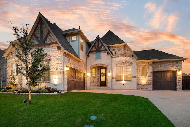 1302 Middleton Dr, Rockwall, TX 75087 - view of front of property with driveway, a lawn, brick siding, a shingled roof, and a garage