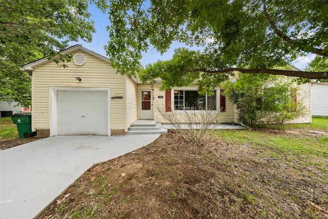 1403 E Texas Ave, Mart, TX 76664 - ranch-style home with concrete driveway and an attached garage