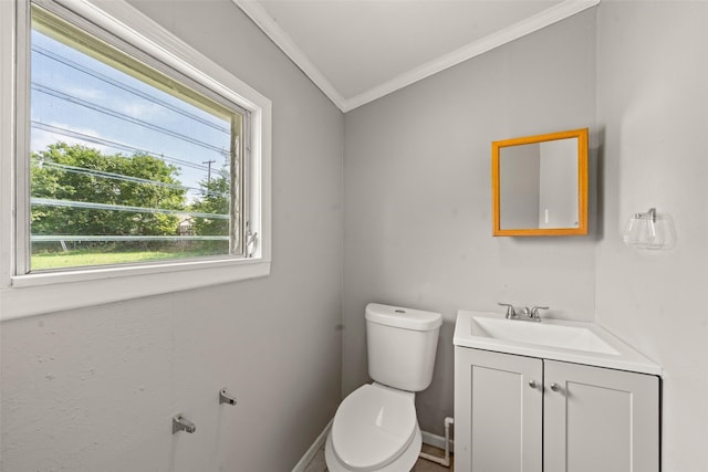 1403 E Texas Ave, Mart, TX 76664 - half bathroom with ornamental molding, toilet, vanity, and baseboards