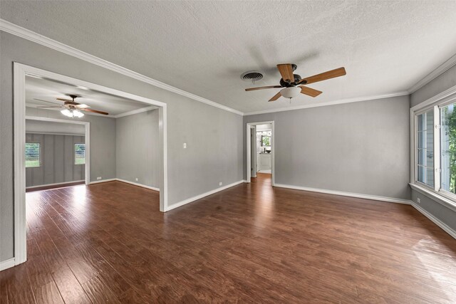 1403 E Texas Ave, Mart, TX 76664 - empty room with ceiling fan, wood finished floors, a textured ceiling, healthy amount of natural light, and ornamental molding
