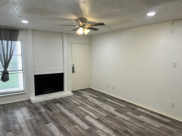 5502 Boca Raton Blvd Unit 329, Fort Worth, TX 76112 - unfurnished living room with a ceiling fan, dark wood finished floors, a textured ceiling, plenty of natural light, and recessed lighting
