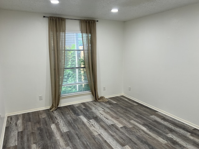 5502 Boca Raton Blvd Unit 329, Fort Worth, TX 76112 - unfurnished room with plenty of natural light, a textured ceiling, dark wood finished floors, recessed lighting, and baseboards