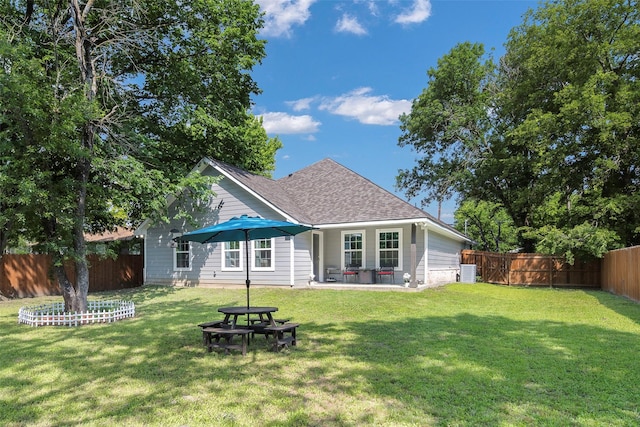 1004 San Jacinto St, Terrell, TX 75160 - rear view of property featuring roof with shingles, cooling unit, and a patio