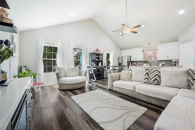 1004 San Jacinto St, Terrell, TX 75160 - living area featuring ceiling fan, high vaulted ceiling, dark wood finished floors, and recessed lighting
