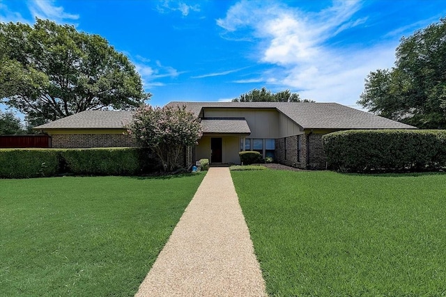 3108 Landershire Ln, Plano, TX 75023 - view of front facade featuring a front yard, brick siding, and a shingled roof