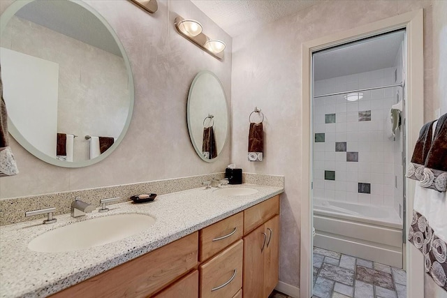 3108 Landershire Ln, Plano, TX 75023 - full bathroom featuring double vanity, tub / shower combination, and stone finish flooring