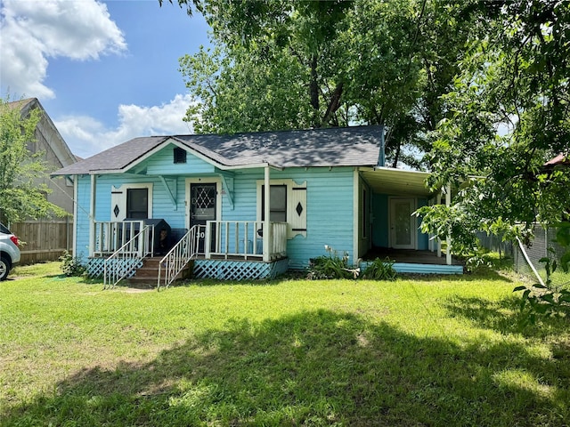 305 N Washington St, Grand Saline, TX 75140 - view of front of home featuring covered porch and a shingled roof