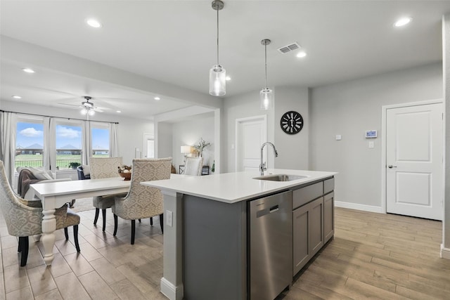 1708 Lapetus, Haslet, TX 76052 - kitchen with a sink, dishwasher, gray cabinetry, light wood finished floors, and light countertops