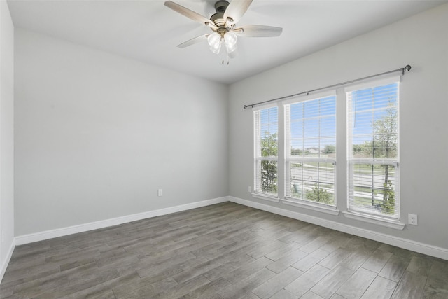 1708 Lapetus, Haslet, TX 76052 - empty room featuring dark wood-type flooring, baseboards, and a ceiling fan