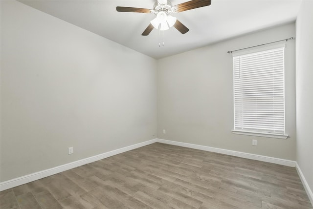 1708 Lapetus, Haslet, TX 76052 - unfurnished room featuring light wood-style floors, baseboards, and a ceiling fan